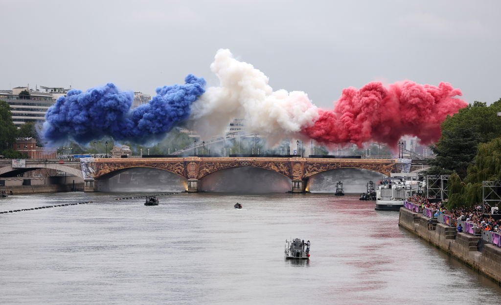 PARIS, FRANCE - JULY 26: Smoke resembling the flag of Team France is shown over Pont d’Austerlitz during the opening ceremony of the Olympic Games Paris 2024 on July 26, 2024 in Paris, France. (Photo by Lars Baron/Getty Images)