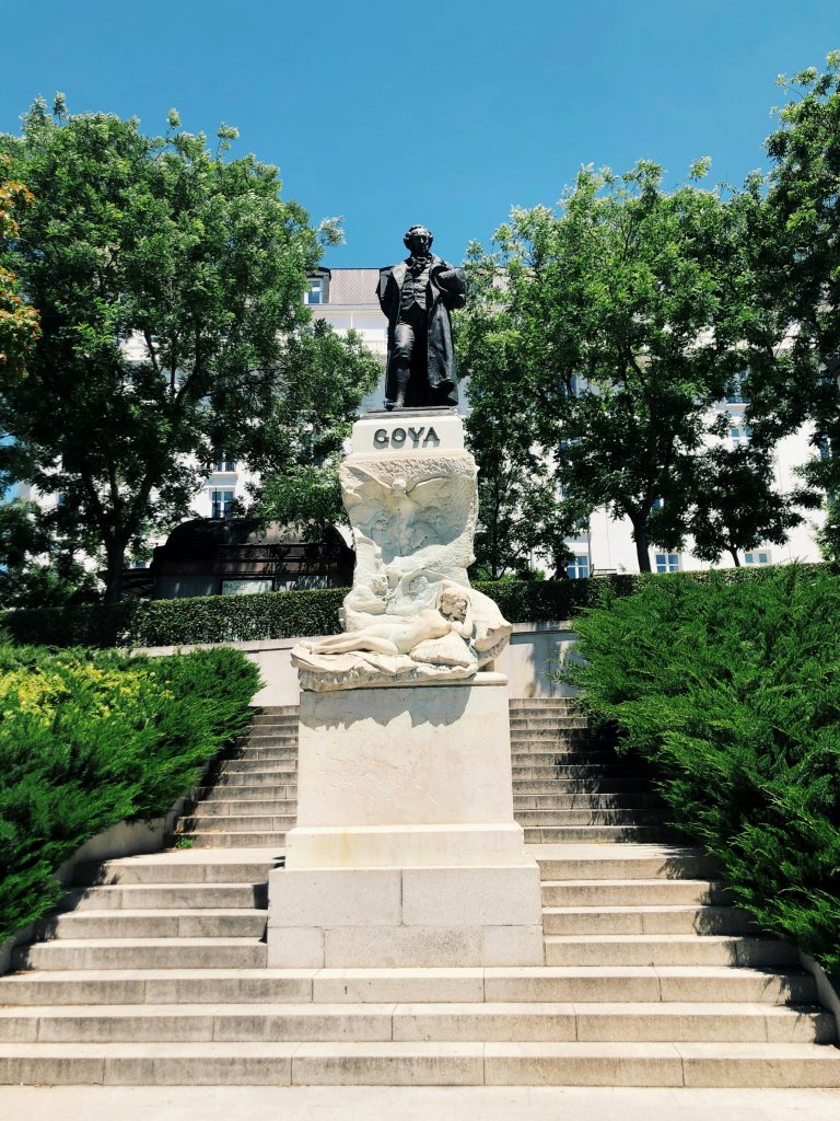 A statue of a man on top of a building
