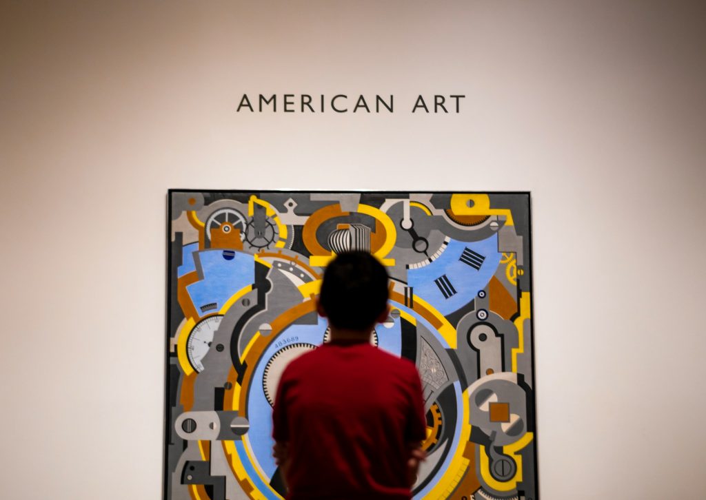 A boy looking at a painting in the Dallas Museum of Art