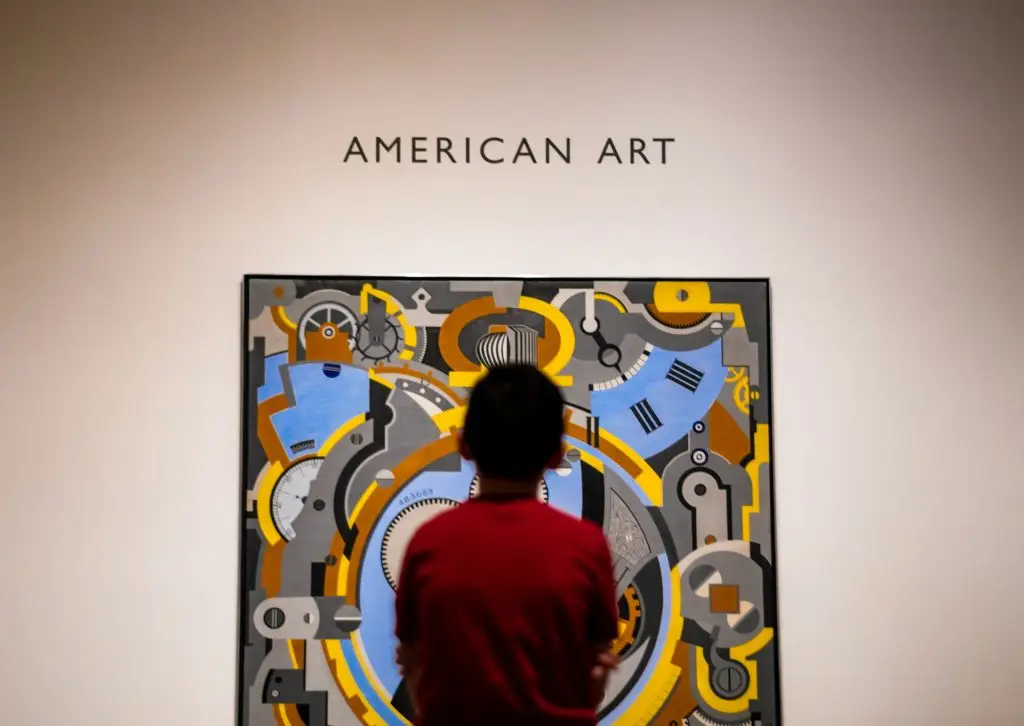 A boy looking at a painting in the Dallas Museum of Art