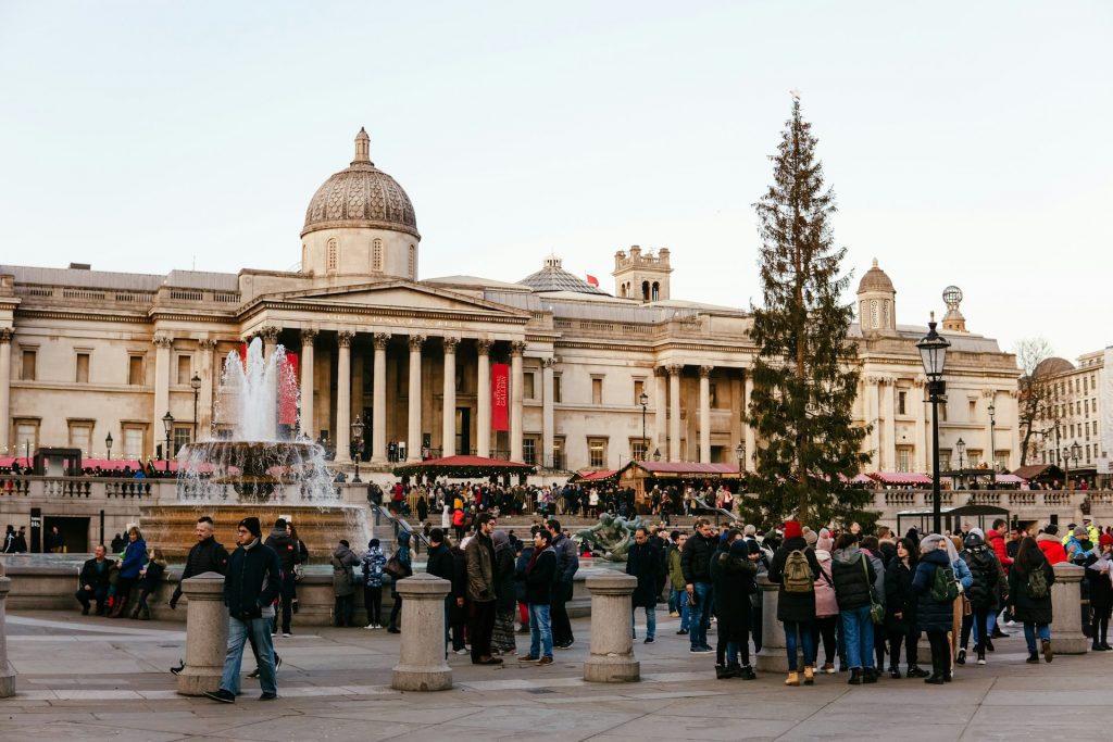 A large crowd of people gathering in front of the National Gallery London