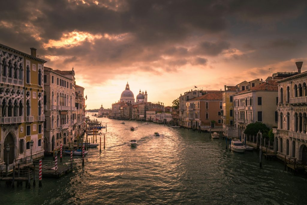 Wide shot of Venice at sunset. Cloudy sky