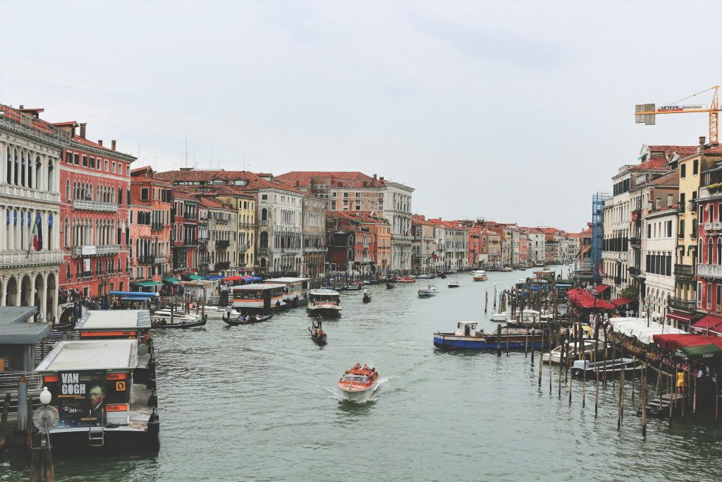 A street in Venice, bustling with boats