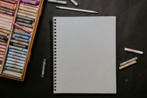 A notebook and drawing supplies